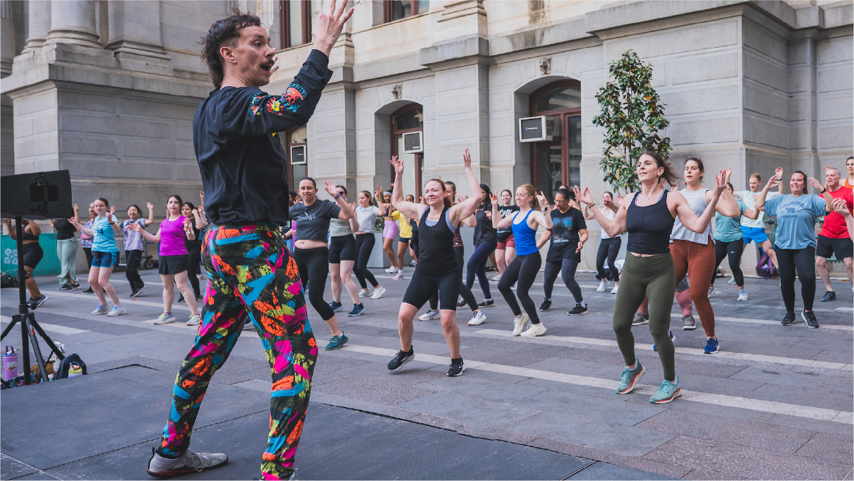 Zumba class outside of city hall building at Dilworth Park