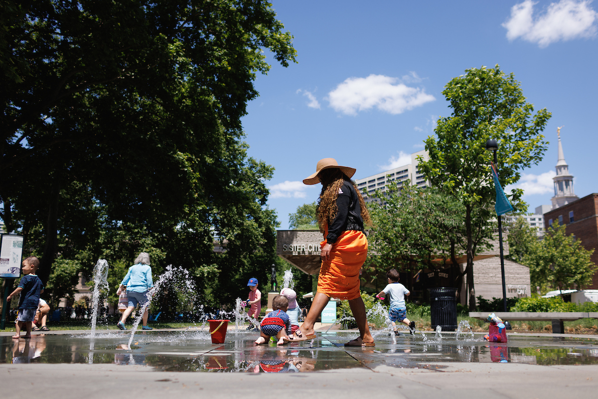 People playing in fountain at Sister Cities Park