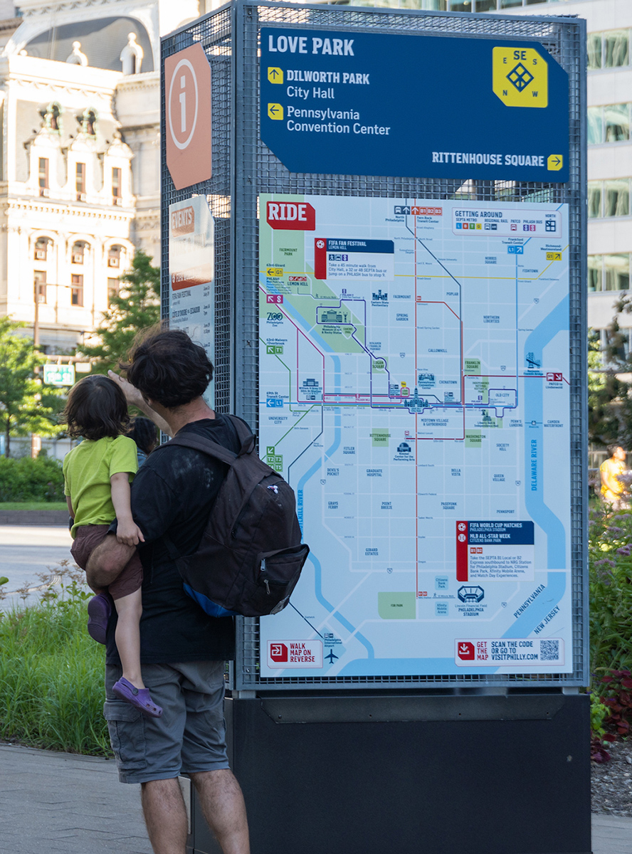 Walk Philadelphia map with parent and child looking for directions.