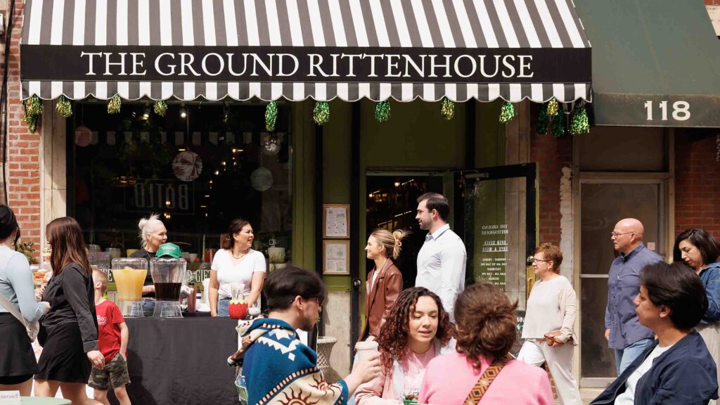 The Ground coffee and gift shop during Open Streets with people sitting, eating and drinking outside.