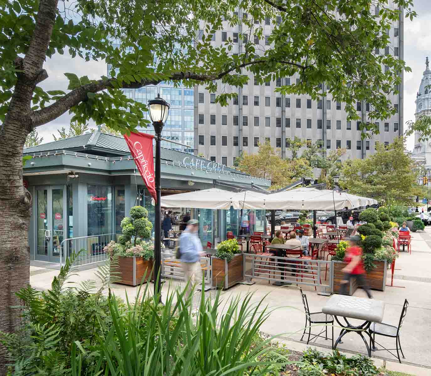 Capriccio Cafe Cret at Cret Park with people eating at outside cafe area.