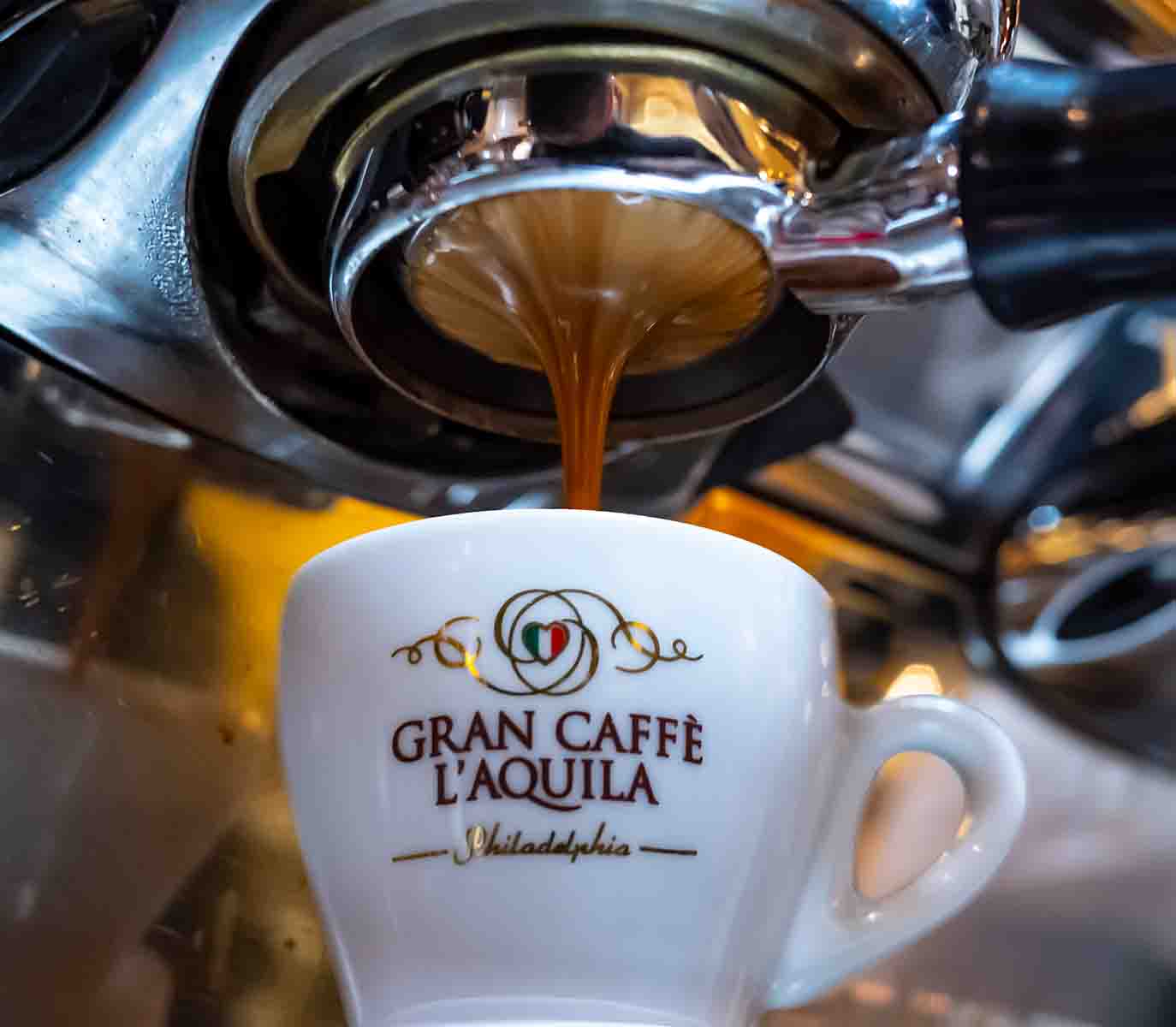Gran Caffe L'Aquila coffee drink being prepared.