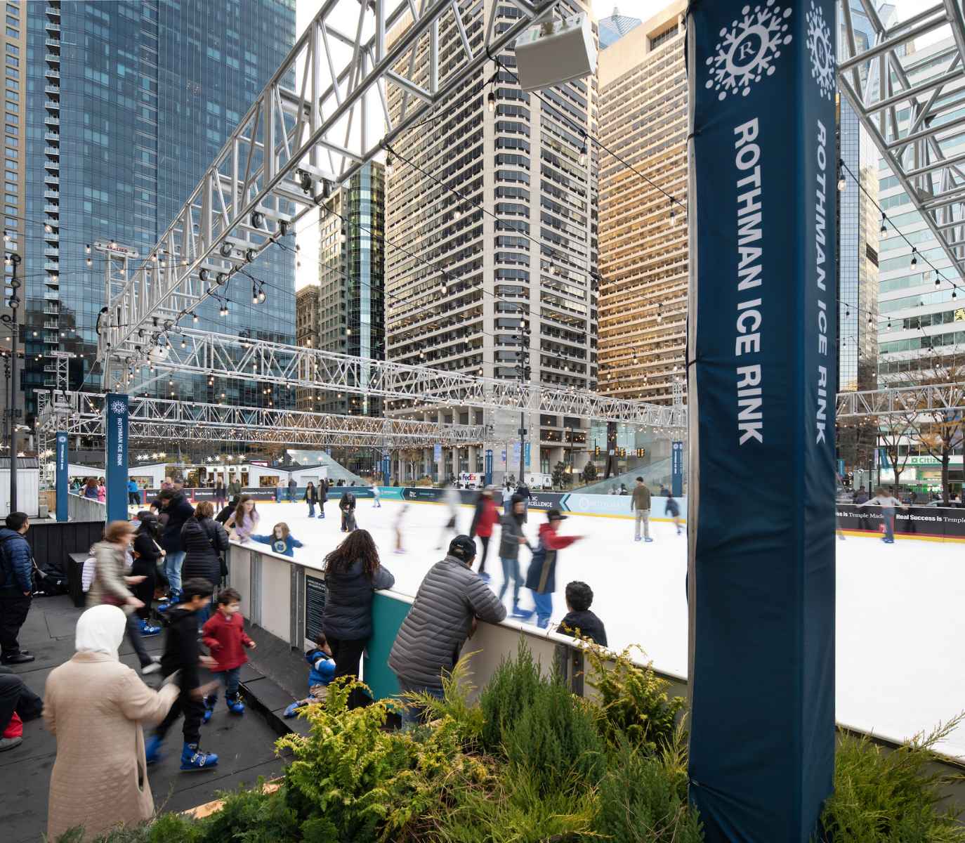 People enjoying the rothman ice rink.